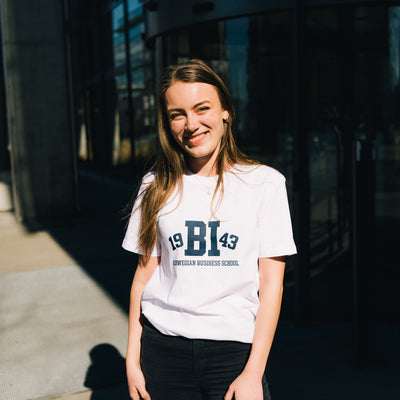 Woman wearing white t-shirt with BI logo